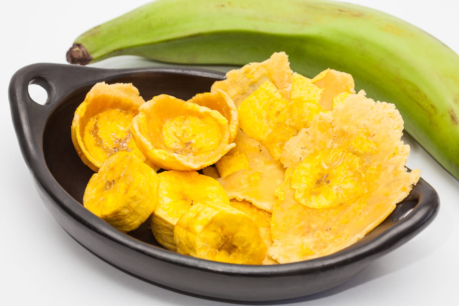 75714524 raw plantain cups patacones and pieces