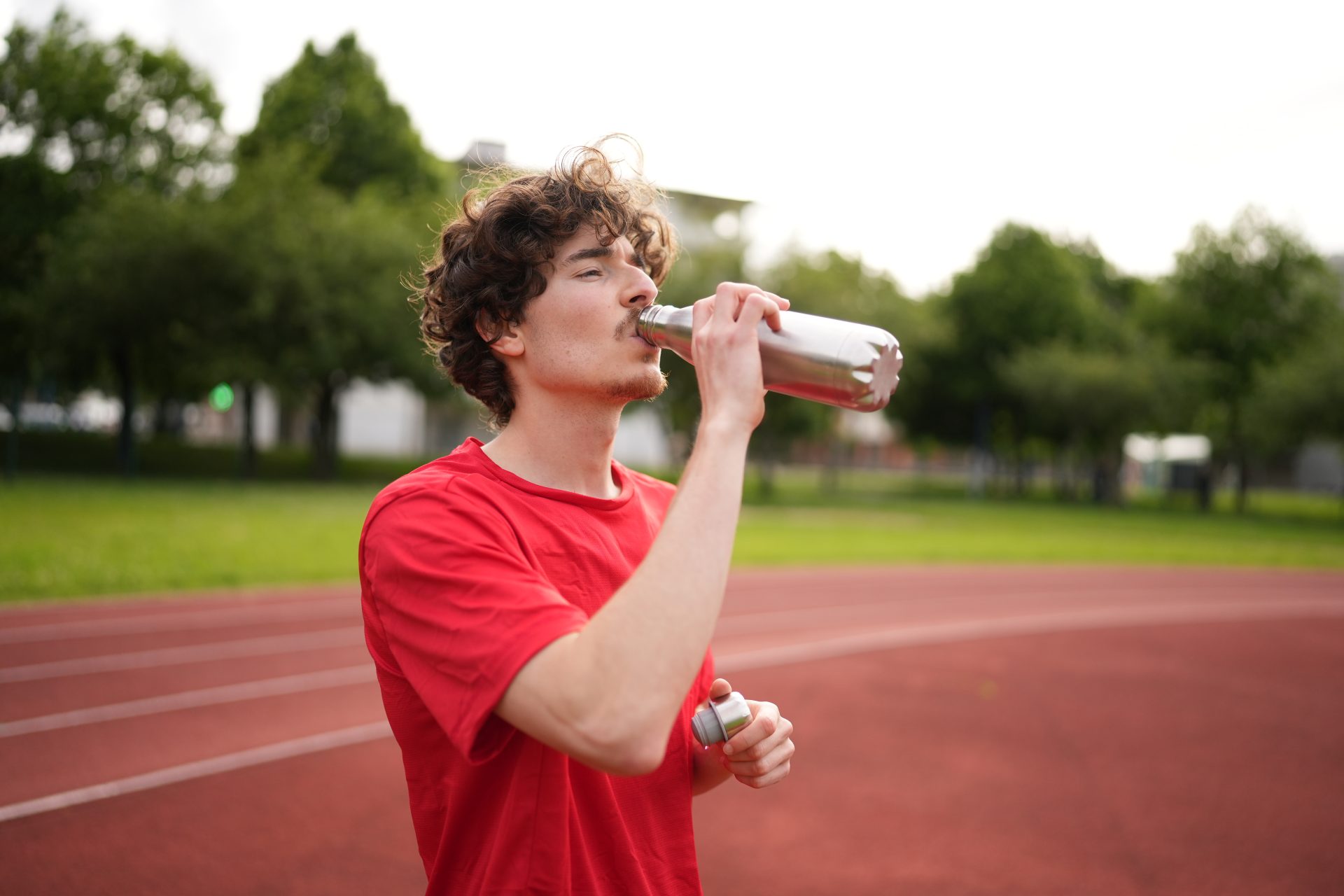 thirsty athlete drinking water after training in a 2025 01 26 12 24 40 utc