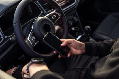 unrecognizable man using mobile phone in car 2024 12 06 22 02 59 utc