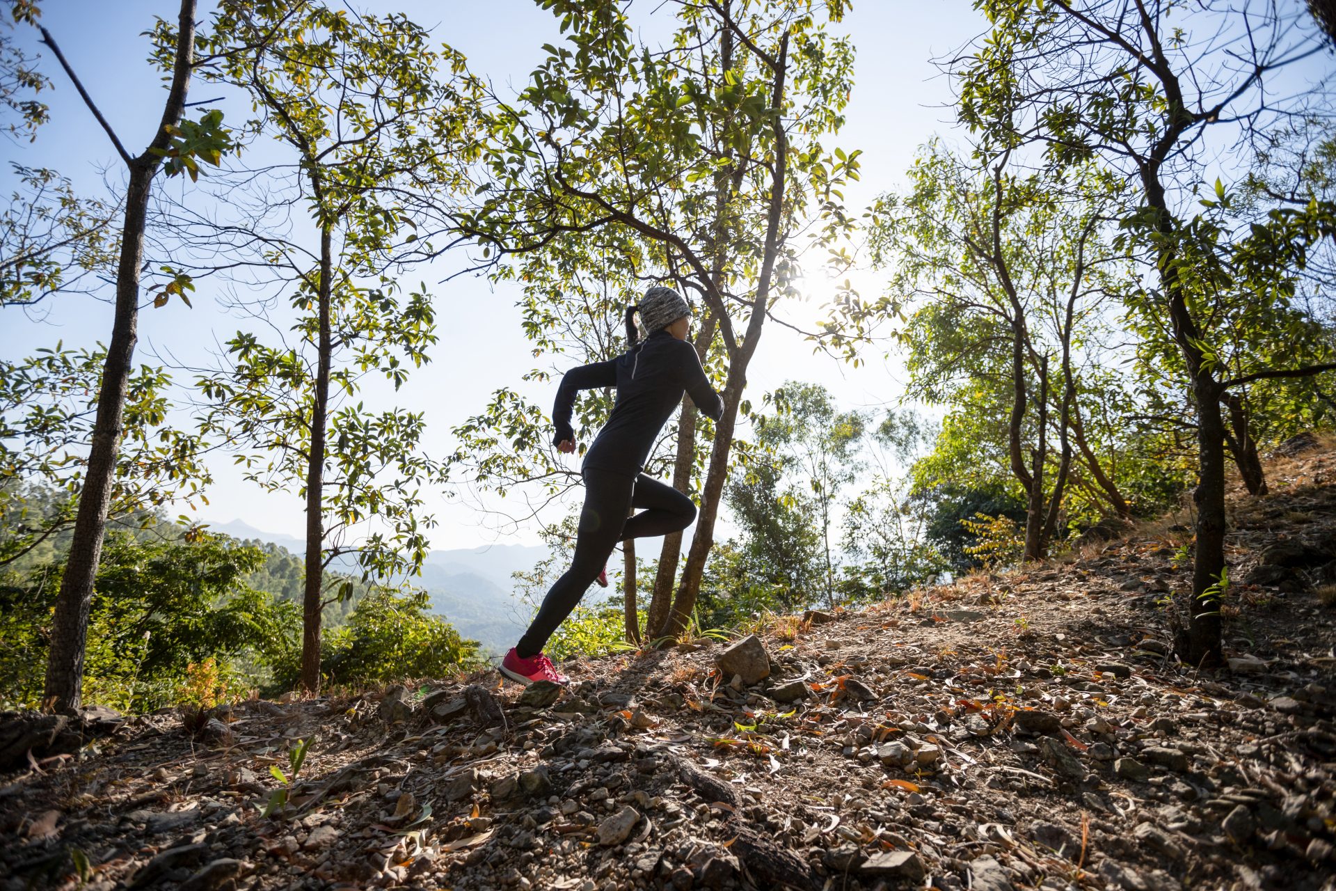 fitness asian woman running on trail at sunrise tr 2024 12 06 08 55 02 utc