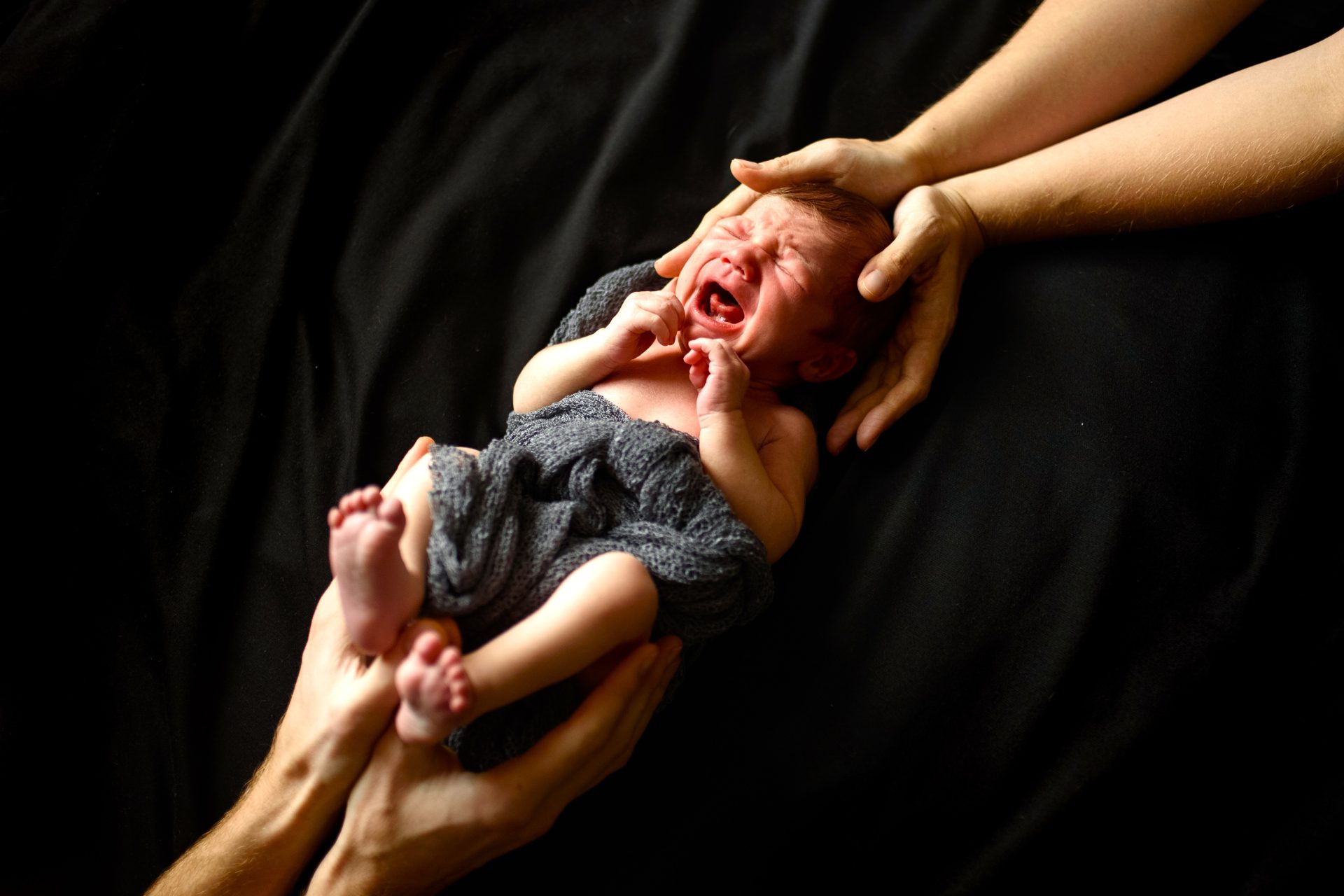 little newborn boy on a black background 2024 10 11 14 14 25 utc 1