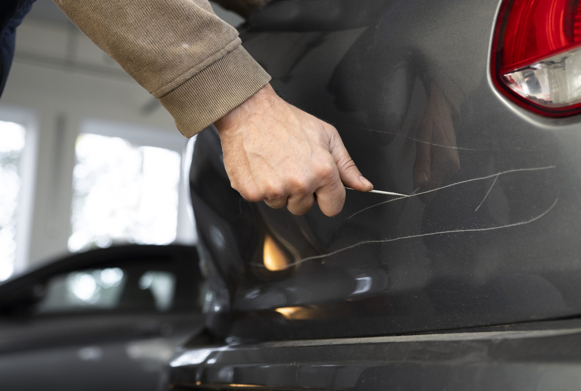a man with a screwdriver in his hand scratches the 2024 11 28 11 49 15 utc