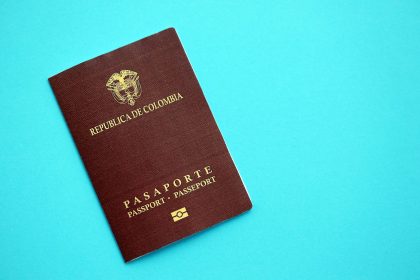colombia republic red passport on light blue table 2026 01 11 11 07 17 utc