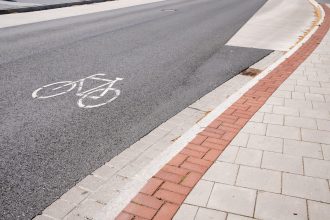 sign printed on the road allowing cycling next to 2026 01 07 01 36 04 utc