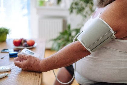 adult checking blood pressure at home on table 2026 03 10 02 07 21 utc