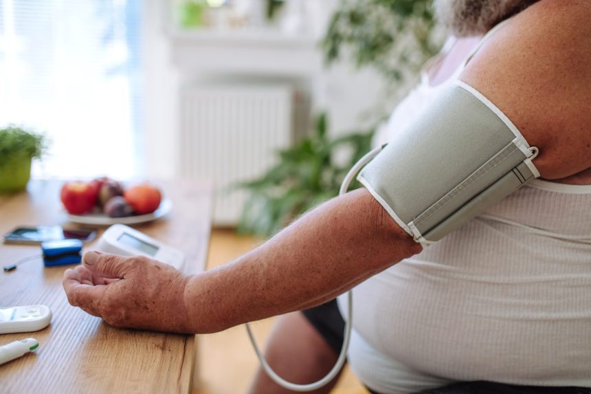 adult checking blood pressure at home on table 2026 03 10 02 07 21 utc