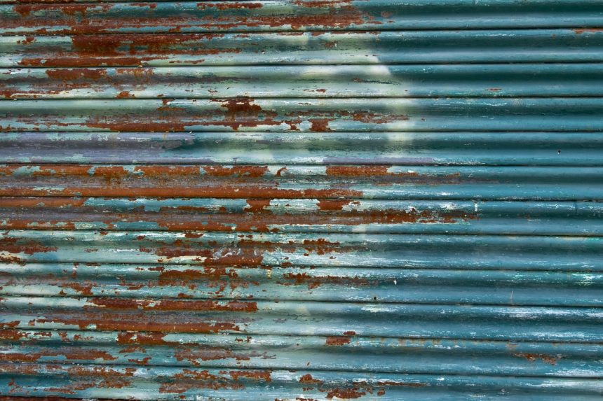rusting metal door with weathered blue paint 2026 01 08 00 27 10 utc