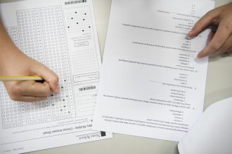 taking an examination with pencil and answer sheet 2026 01 07 23 44 56 utc